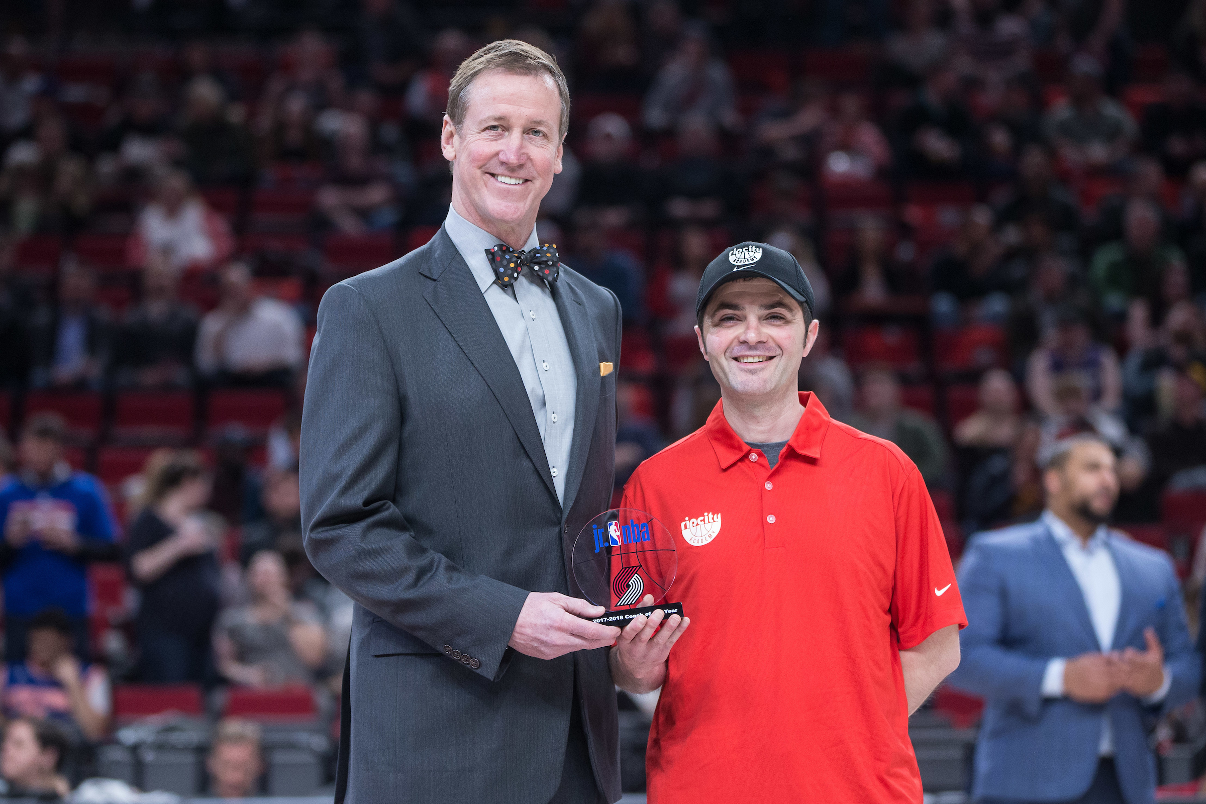 Terry Stotts, head coach of the Portland Trail Blazers, presents
the Junior NBA Coach of the Year Award to Matt Morrison of
THPRD before a recent Blazers home game.